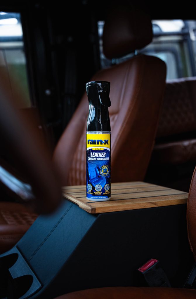 A bottle of Rain-X Leather cleaner in a car